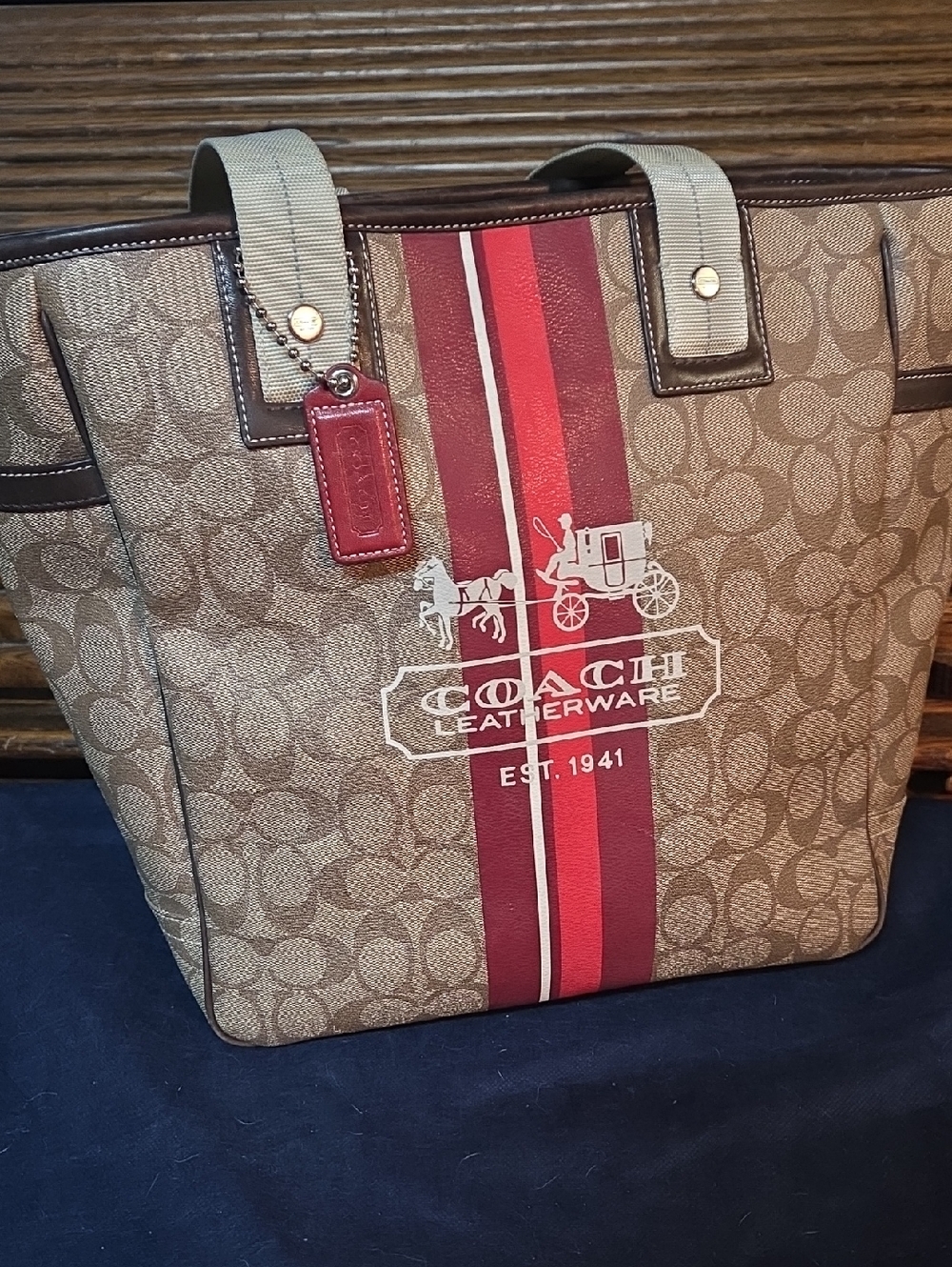 COACH Men’s Signature Canvas Tote Bag in Brown with Red Stripe